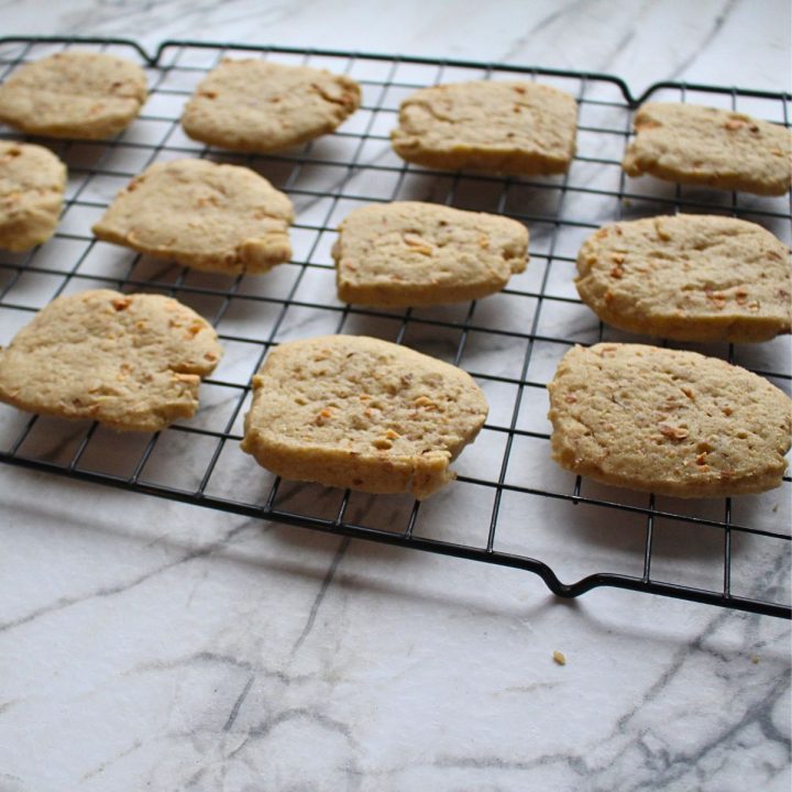 Almond Icebox Cookies on a cooling rack.