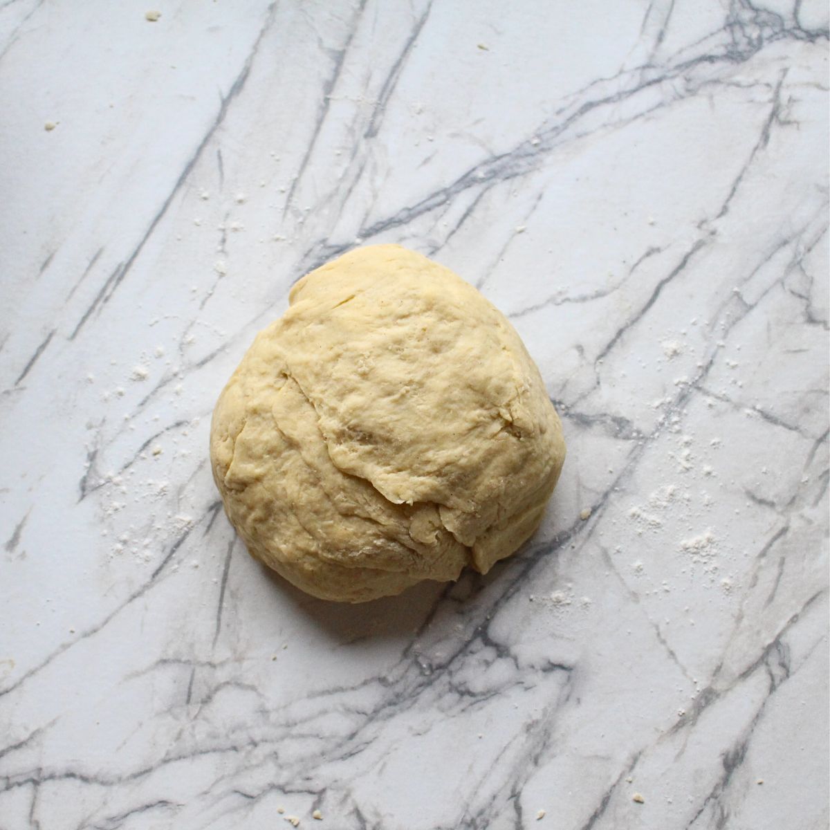 Swedish cardamom coffee cake dough in a ball after kneading.