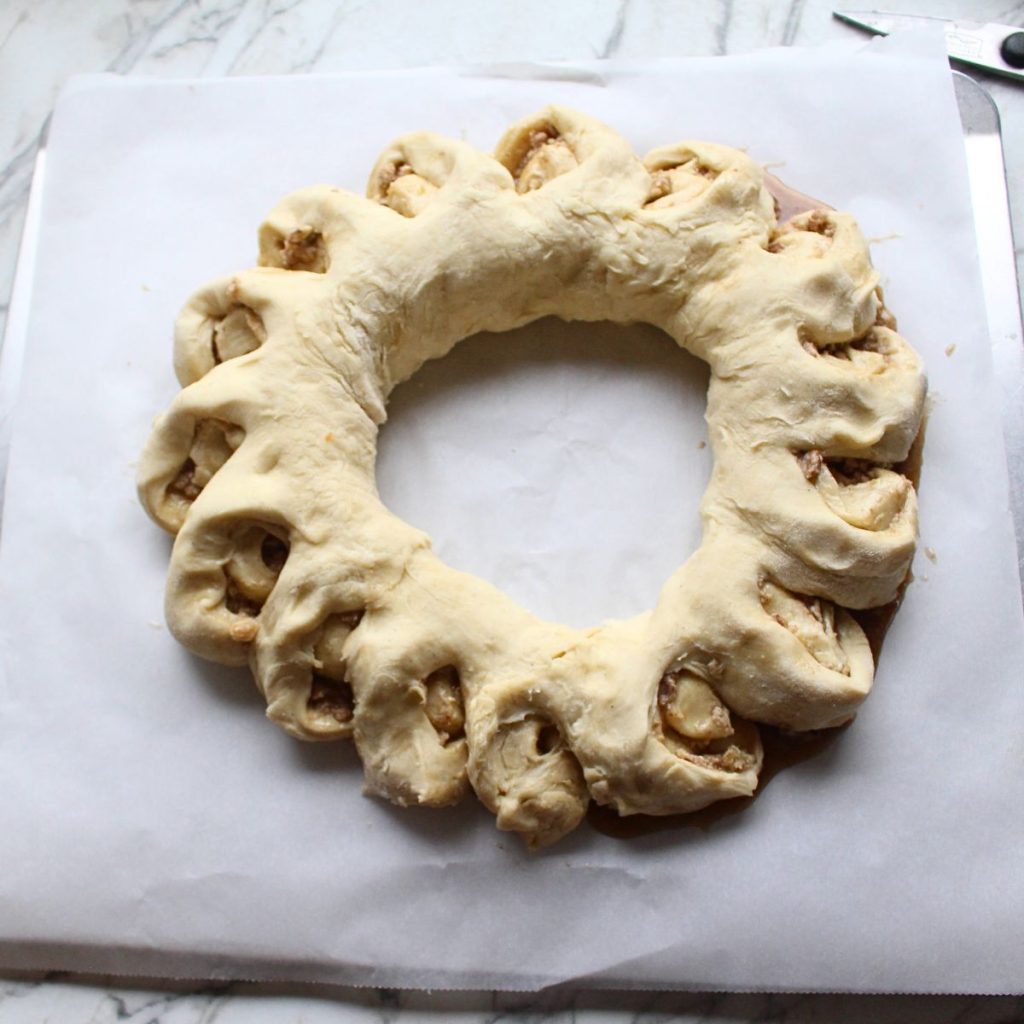 Swedish cardamom coffee cake after pieces of the ring have been cut and turned.