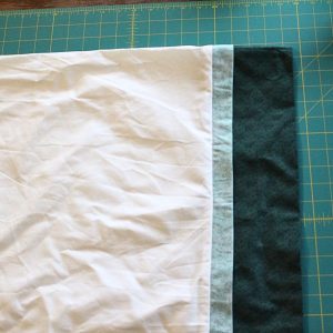 The contrasting band and trim after it is pressed away from the pillowcase body.