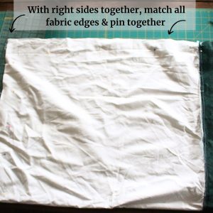 The pillowcase folded right sides together and pinned, with instructions at the top.