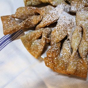 A close up of Fattigmann cookies on a plate.