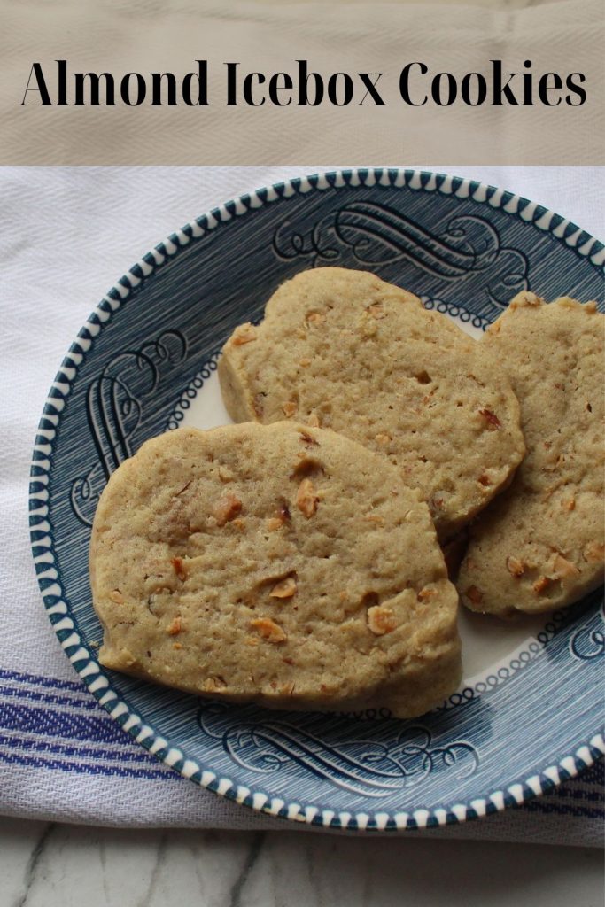 Three Almond Icebox Cookies on a plate with the name above.