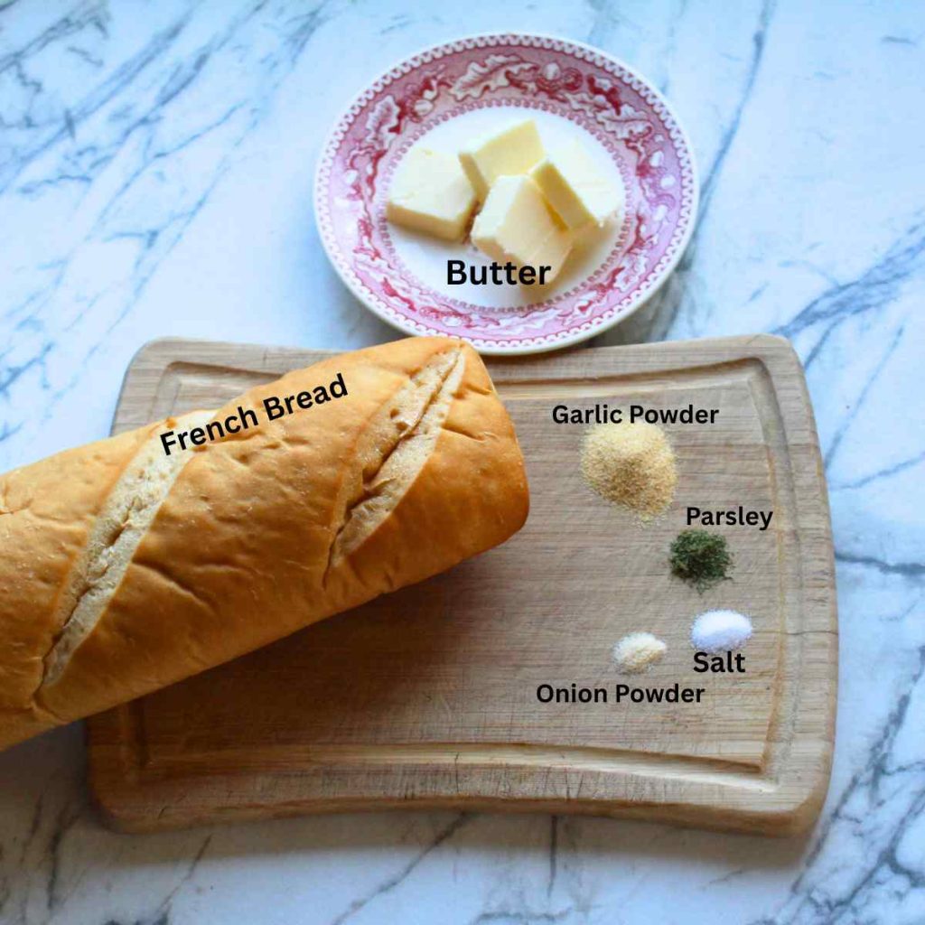 The ingredients for homemade garlic bread laid out and labeled.