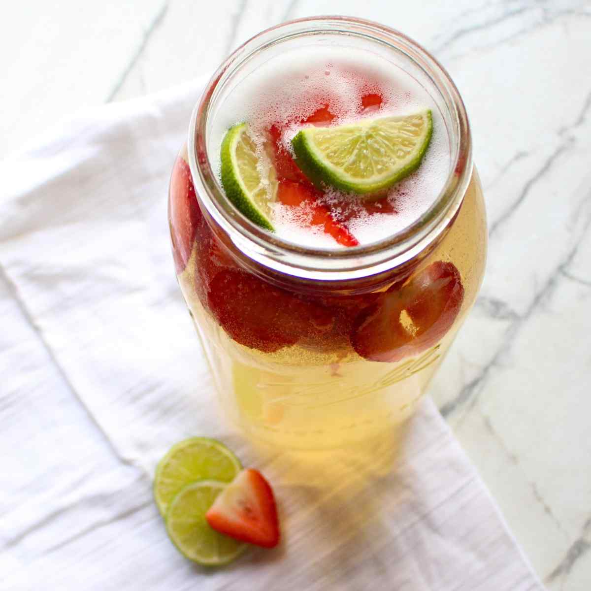 A mason jar full of homemade strawberry limeade.
