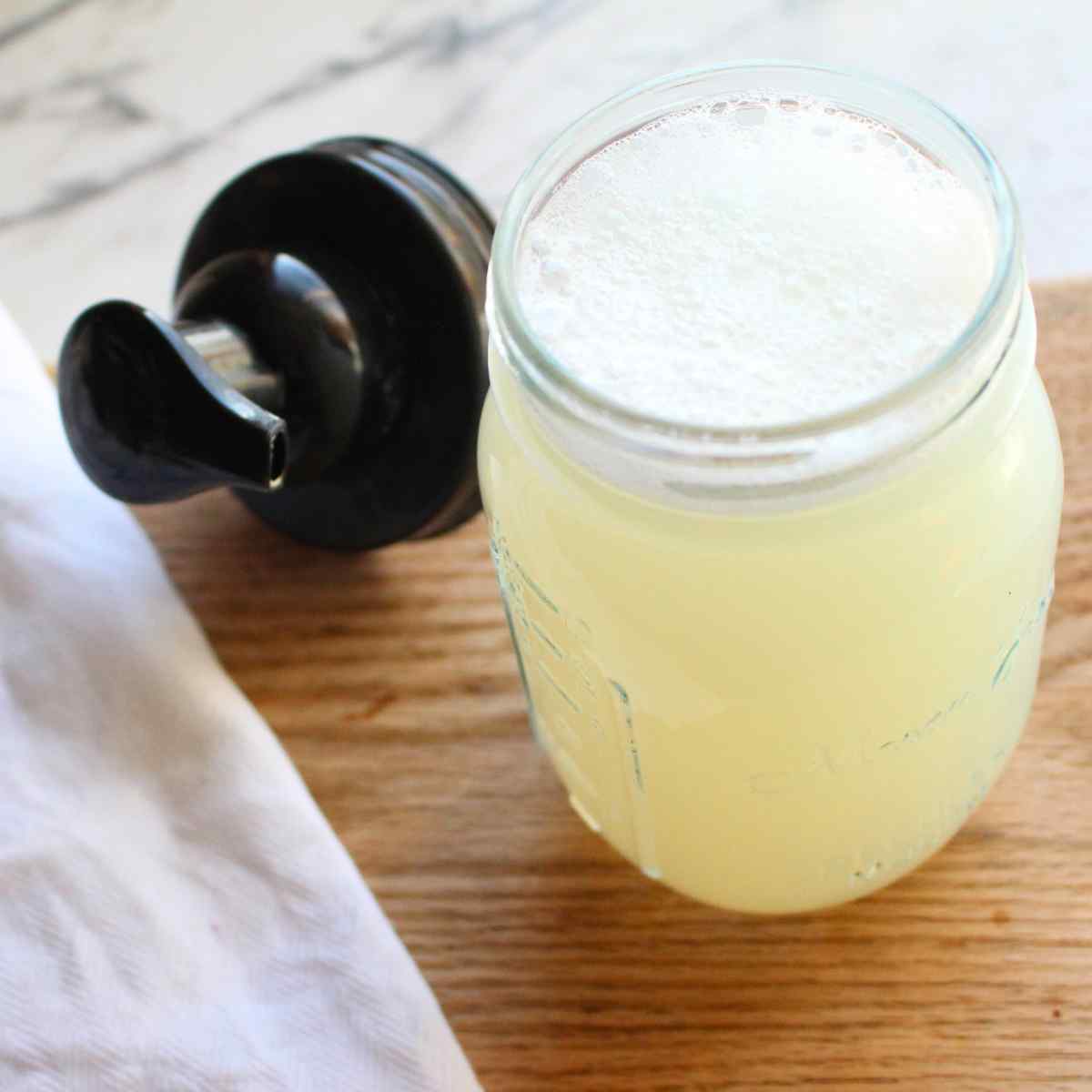 A foaming hand soap jar filled with DIY foaming hand soap.